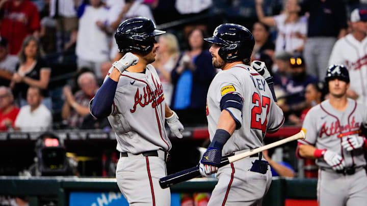 Apr 2, 2026; Phoenix, Arizona, USA; Atlanta Braves first baseman Matt Olson (28) celebrates a  solo homer  with Atlanta Braves third baseman Austin Riley (27) during the first inning at Chase Field against the Atlanta Braves. Mandatory Credit: Arianna Grainey-Imagn Images