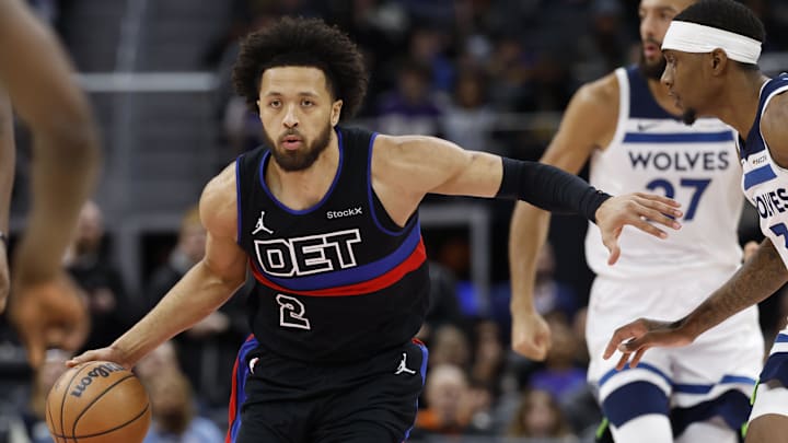 Jan 4, 2025; Detroit, Michigan, USA;  Detroit Pistons guard Cade Cunningham (2) dribbles in the first half against the Minnesota Timberwolves at Little Caesars Arena. Mandatory Credit: Rick Osentoski-Imagn Images
