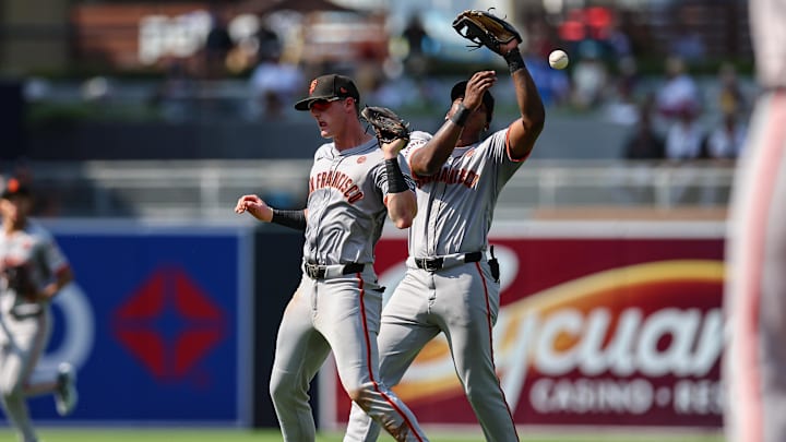 Sep 8, 2024; San Diego, California, USA; San Francisco Giants shortstop Tyler Fitzgerald (49), left, and second baseman Marco Luciano (37) collide while trying to catch a fly ball from San Diego Padres left fielder Jurickson Profar (not pictured) during the seventh inning at Petco Park. Sep 8, 2024; San Diego, California, USA; San Francisco Giants shortstop Tyler Fitzgerald (49), left, and second baseman Marco Luciano (37) collide while trying to catch a fly ball from San Diego Padres left fielder Jurickson Profar (not pictured) during the seventh inning at Petco Park.