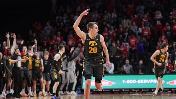 Feb 12, 2025; Piscataway, New Jersey, USA; Iowa Hawkeyes forward Payton Sandfort (20) celebrates after a basket during the second half against the Rutgers Scarlet Knights at Jersey Mike's Arena. Mandatory Credit: Vincent Carchietta-Imagn Images Feb 12, 2025; Piscataway, New Jersey, USA; Iowa Hawkeyes forward Payton Sandfort (20) celebrates after a basket during the second half against the Rutgers Scarlet Knights at Jersey Mike's Arena. Mandatory Credit: Vincent Carchietta-Imagn Images
