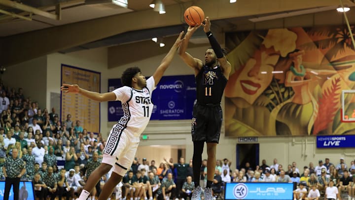 Nov 26, 2024; Lahaina, Hawaii, USA; Memphis Tigers guard Tyrese Hunter (11) makes a three point shot and is fouled by Michigan State Spartans guard Jase Richardson (11) in the second half at Lahaina Civic Center. Mandatory Credit: Marco Garcia-Imagn Images
Nov 26, 2024; Lahaina, Hawaii, USA; Memphis Tigers guard Tyrese Hunter (11) makes a three point shot and is fouled by Michigan State Spartans guard Jase Richardson (11) in the second half at Lahaina Civic Center. Mandatory Credit: Marco Garcia-Imagn Images