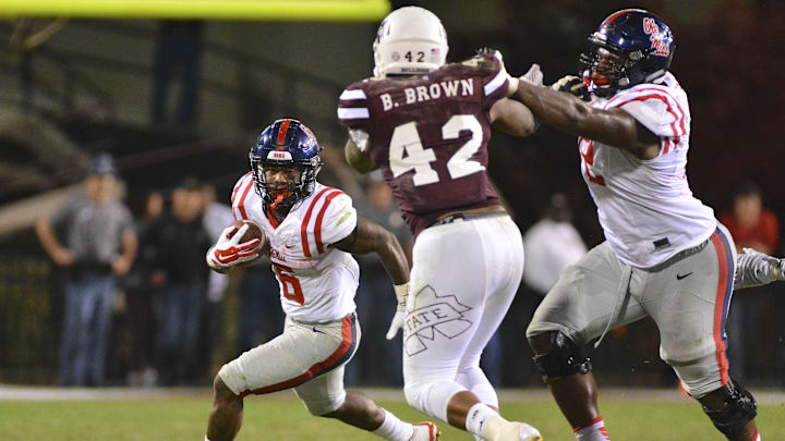 Nov 28, 2015; Starkville, MS, USA; Mississippi Rebels running back Jaylen Walton (6) runs the ball during the fourth quarter against the Mississippi Rebels at Davis Wade Stadium. Mississippi won 38-27. Mandatory Credit: Matt Bush-Imagn Images