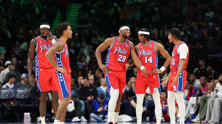 Mar 14, 2025; Philadelphia, Pennsylvania, USA; Philadelphia 76ers forward Guerschon Yabusele (28) reacts with guard Ricky Council IV (14), guard Jeff Dowtin Jr (11), guard Jalen-Hood Schifino (17), and center Adem Bona (30) against the Indiana Pacers in the second quarter at Wells Fargo Center. Mandatory Credit: Kyle Ross-Imagn Images