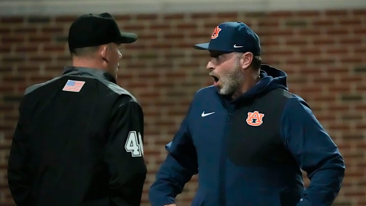 Auburn head coach Butch Thompson argues with umpires during the game with Alabama at Sewell-Thomas Stadium.