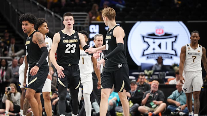 Mar 12, 2025; Kansas City, MO, USA; Colorado Buffaloes forward Andrej Jakimovski (23) slaps hands with Colorado Buffaloes forward Trevor Baskin (6) during the second half against the West Virginia Mountaineers at T-Mobile Center. Mandatory Credit: William Purnell-Imagn Images