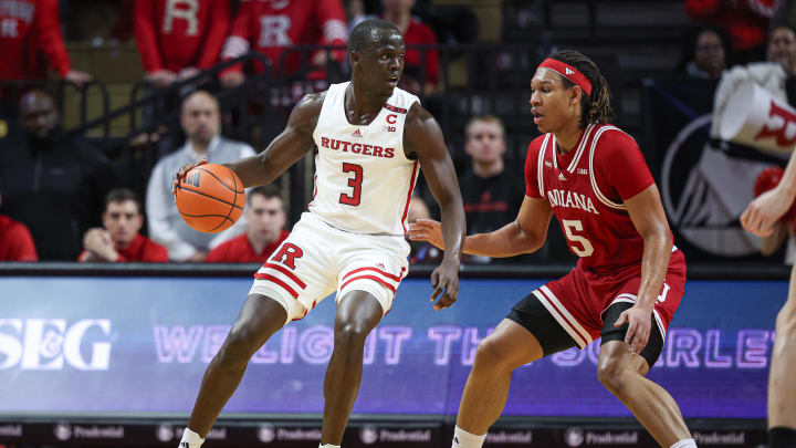Jan 9, 2024; Piscataway, New Jersey, USA; Rutgers Scarlet Knights forward Mawot Mag (3) dribbles against Indiana Hoosiers forward Malik Reneau (5) during the first half at Jersey Mike's Arena. Mandatory Credit: Vincent Carchietta-USA TODAY Sports Jan 9, 2024; Piscataway, New Jersey, USA; Rutgers Scarlet Knights forward Mawot Mag (3) dribbles against Indiana Hoosiers forward Malik Reneau (5) during the first half at Jersey Mike's Arena. Mandatory Credit: Vincent Carchietta-USA TODAY Sports