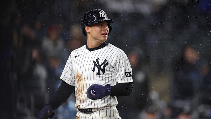 Anthony Volpe looks back after scoring against the Giants.