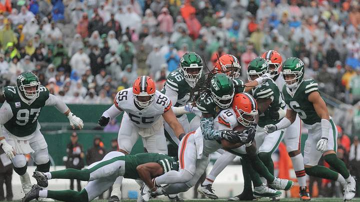 Oct 11, 2026; East Rutherford, New Jersey, USA;  Cleveland Browns running back Quinshon Judkins (10) is tackled by New York Jets linebacker Demario Davis (56) during the first half at MetLife Stadium.  Mandatory Credit: Brad Penner-Imagn Images
