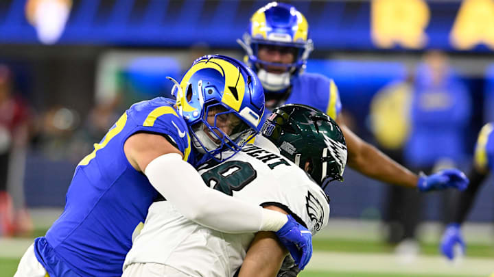 Nov 24, 2024; Inglewood, California, USA; Los Angeles Rams linebacker Michael Hoecht (97) brings down Philadelphia Eagles tight end Dallas Goedert (88) after a catch during the first half at SoFi Stadium. Nov 24, 2024; Inglewood, California, USA; Los Angeles Rams linebacker Michael Hoecht (97) brings down Philadelphia Eagles tight end Dallas Goedert (88) after a catch during the first half at SoFi Stadium.