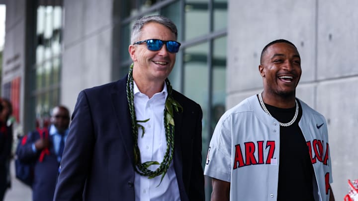Oct 19, 2024; Tucson, Arizona, USA; Arizona Wildcats head coach Brent Brennan walks with honorary captain Khalil Tate down the Wildcat Walk before the game against Colorado Buffaloes at Arizona Stadium. Mandatory Credit: Aryanna Frank-Imagn Images