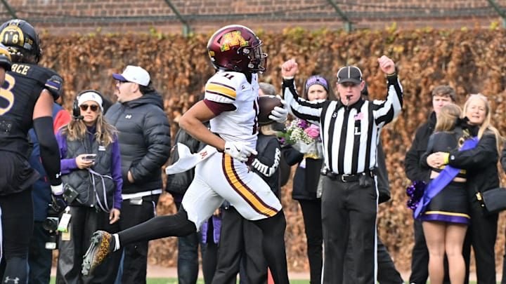 Nov 22, 2025; Chicago, Illinois, USA; Minnesota Golden Gophers wide receiver Javon Tracy (11) runs in for a touchdown against the Northwestern Wildcats during the first half at Wrigley Field. Mandatory Credit: Patrick Gorski-Imagn Images Nov 22, 2025; Chicago, Illinois, USA; Minnesota Golden Gophers wide receiver Javon Tracy (11) runs in for a touchdown against the Northwestern Wildcats during the first half at Wrigley Field. Mandatory Credit: Patrick Gorski-Imagn Images