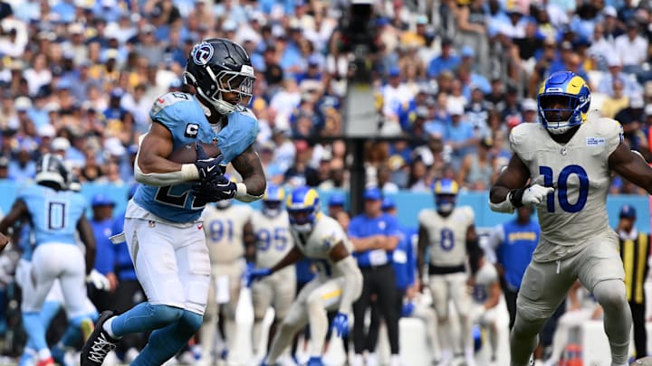 Sep 14, 2025; Nashville, Tennessee, USA; Tennessee Titans running back Tony Pollard (20) rushes the ball against the Los Angeles Rams during the second half at Nissan Stadium. Mandatory Credit: Steve Roberts-Imagn Images