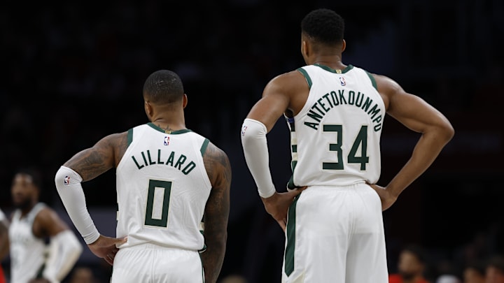Nov 20, 2023; Washington, District of Columbia, USA; Milwaukee Bucks guard Damian Lillard (0) and Bucks forward Giannis Antetokounmpo (34) stand on the court against the Washington Wizards in the second quarter at Capital One Arena. Mandatory Credit: Geoff Burke-Imagn Images Nov 20, 2023; Washington, District of Columbia, USA; Milwaukee Bucks guard Damian Lillard (0) and Bucks forward Giannis Antetokounmpo (34) stand on the court against the Washington Wizards in the second quarter at Capital One Arena. Mandatory Credit: Geoff Burke-Imagn Images