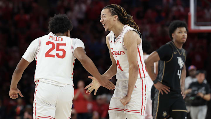 Feb 4, 2026; Houston, Texas, USA; Houston Cougars guard Mercy Miller (25) celebrates a basket by guard Kingston Flemings (4) in the second half against the UCF Knights at Fertitta Center. Mandatory Credit: Thomas Shea-Imagn Images