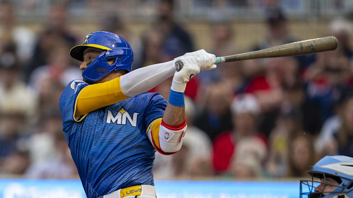 Jun 6, 2025; Minneapolis, Minnesota, USA; Minnesota Twins third baseman Royce Lewis (23) hits a double against the Toronto Blue Jays in the second inning at Target Field. Mandatory Credit: Jesse Johnson-Imagn Images
