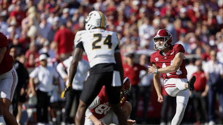 Oct 26, 2024; Tuscaloosa, Alabama, USA;  Alabama Crimson Tide place kicker Graham Nicholson (14) kicks a field goal against the Missouri Tigers during the first half at Bryant-Denny Stadium. Mandatory Credit: Butch Dill-Imagn Images
