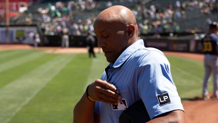 Aug 25, 2024; Oakland, California, USA; Home plate umpire CB Bucknor takes the field before a game between the Oakland Athletics and Milwaukee Brewers at Oakland-Alameda County Coliseum. Mandatory Credit: D. Ross Cameron-Imagn Images Aug 25, 2024; Oakland, California, USA; Home plate umpire CB Bucknor takes the field before a game between the Oakland Athletics and Milwaukee Brewers at Oakland-Alameda County Coliseum. Mandatory Credit: D. Ross Cameron-Imagn Images
