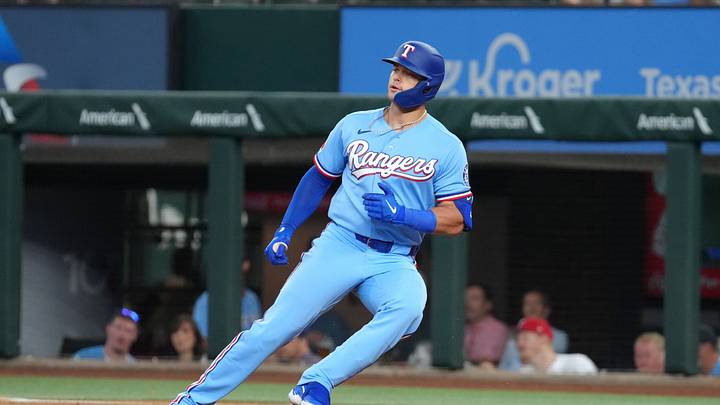 Aug 23, 2026; Arlington, Texas, USA; Texas Rangers designated hitter Logan O'Hoppe (4) stops and runs back to first base on his single against the Los Angeles Angels during the second inning at Globe Life Field. Mandatory Credit: Jim Cowsert-Imagn Images Aug 23, 2026; Arlington, Texas, USA; Texas Rangers designated hitter Logan O'Hoppe (4) stops and runs back to first base on his single against the Los Angeles Angels during the second inning at Globe Life Field. Mandatory Credit: Jim Cowsert-Imagn Images