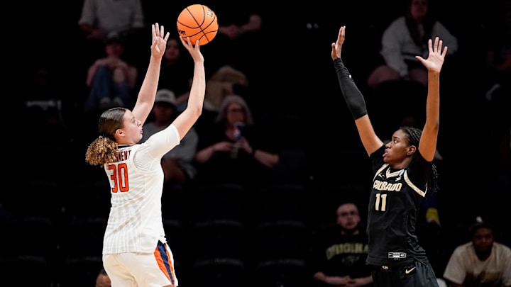 Illinois forward Cearah Parchment (30) shoots past Colorado forward Logyn Greer (11) during the first half in the first round of the NCAA college basketball tournament at Memorial Gym in Nashville, Tenn., Saturday, March 21, 2026.