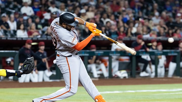 Sep 16, 2025; Phoenix, Arizona, USA; San Francisco Giants outfielder Jerar Encarnacion hits a two run double in the first inning against the Arizona Diamondbacks at Chase Field. Mandatory Credit: Mark J. Rebilas-Imagn Images