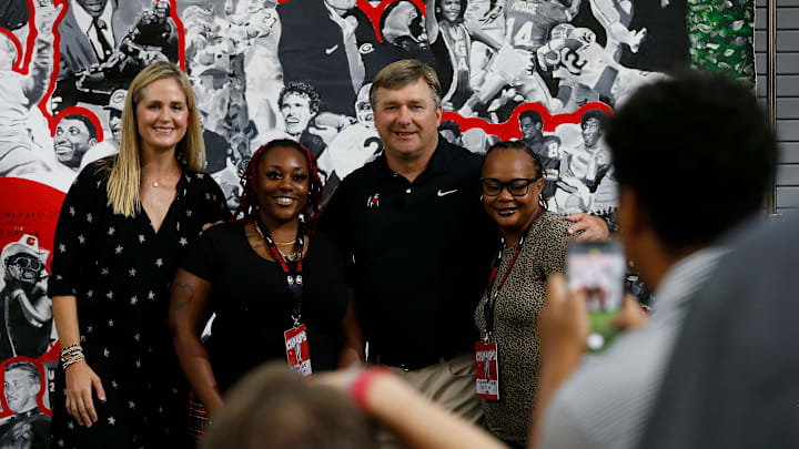 Kirby and Mary Beth Smart pose for photos with fans and supporters during the Kirby Smart Family Foundation's Giving Day at the UGA Football Indoor Practice Facility in Athens, Ga., on Wednesday, Aug. 10, 2022. The Kirby Smart Family Foundation supports over 70 organizations in Georgia and neighboring states that help children and families who are facing adversity such as disability and childhood cancer.

News Joshua L Jones