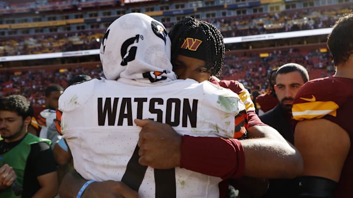 Oct 6, 2024; Landover, Maryland, USA; Washington Commanders quarterback Jayden Daniels (5) hugs Cleveland Browns quarterback Deshaun Watson (4) after their game at NorthWest Stadium. 