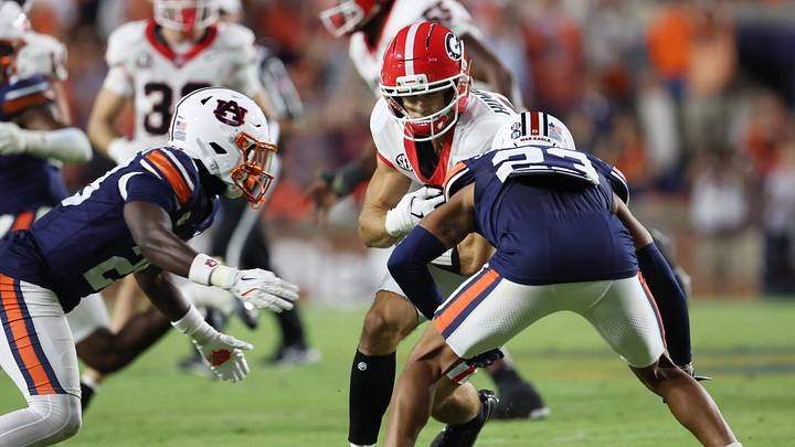 Oct 11, 2025; Auburn, Alabama, USA; Auburn Tigers defensive back Kensley Louidor-Faustin (28) and cornerback Jay Crawford (23) close in on Georgia Bulldogs wide receiver London Humphreys (16) during the fourth quarter at Jordan-Hare Stadium. Mandatory Credit: John Reed-Imagn Images Oct 11, 2025; Auburn, Alabama, USA; Auburn Tigers defensive back Kensley Louidor-Faustin (28) and cornerback Jay Crawford (23) close in on Georgia Bulldogs wide receiver London Humphreys (16) during the fourth quarter at Jordan-Hare Stadium. Mandatory Credit: John Reed-Imagn Images