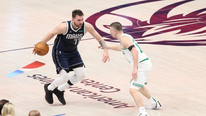 Jun 14, 2024; Dallas, Texas, USA; Dallas Mavericks guard Luka Doncic (77) dribbles against -Boston Celtics guard Payton Pritchard (11) during the first half of game four of the 2024 NBA Finals at American Airlines Center. Mandatory Credit: Kevin Jairaj-USA TODAY Sports