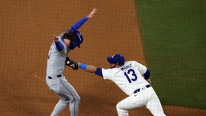 Los Angeles Dodgers third base Max Muncy (13) gets the tag on New York Mets outfielder Jesse Winker (3) for an out in the fourth inning during game one of the NLCS for the 2024 MLB Playoffs at Dodger Stadium on Oct 13.