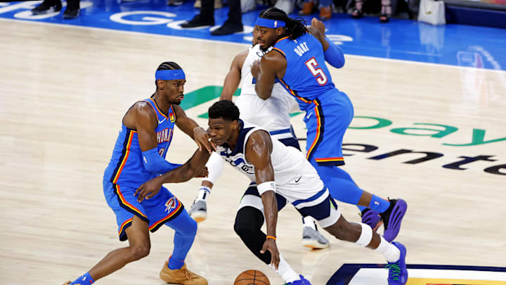 May 28, 2025; Oklahoma City, Oklahoma, USA; Minnesota Timberwolves guard Anthony Edwards (5) drives to the basket against Oklahoma City Thunder guard Shai Gilgeous-Alexander (2) in game five of the western conference finals for the 2025 NBA Playoffs at Paycom Center. Mandatory Credit: Alonzo Adams-Imagn Images