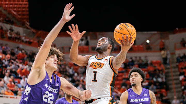 Kansas State's Dorin Buca plays defense on Oklahoma State's Kanye Clary during the first half at Gallagher-Iba Arena.