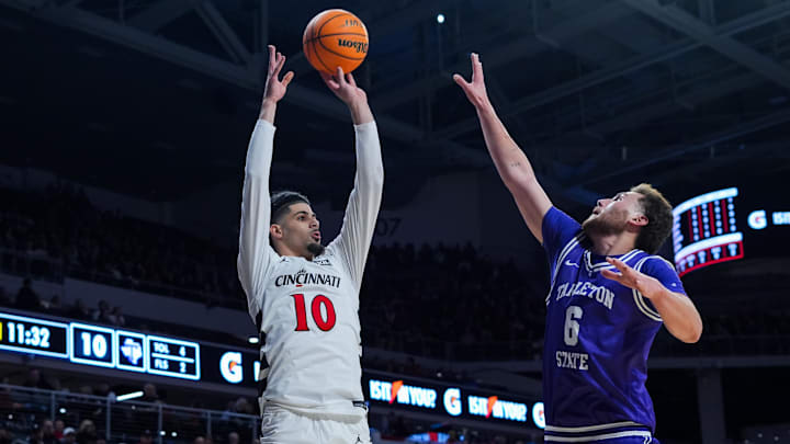 Dec 1, 2025; Cincinnati, Ohio, USA;  Cincinnati Bearcats guard Shon Abaev (10) attempts a 3-point shot against Tarleton State Texans guard Kaia Isaac (6) in the first half at Fifth Third Arena.