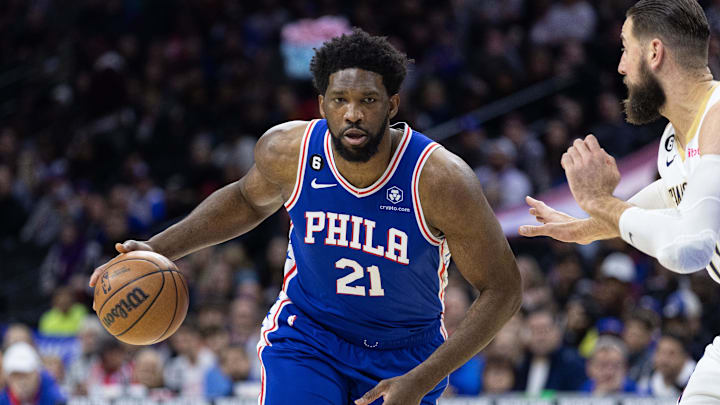 Jan 2, 2023; Philadelphia, Pennsylvania, USA; Philadelphia 76ers center Joel Embiid (21) dribbles the ball against New Orleans Pelicans center Jonas Valanciunas (17) during the first quarter at Wells Fargo Center. Mandatory Credit: Bill Streicher-Imagn Images