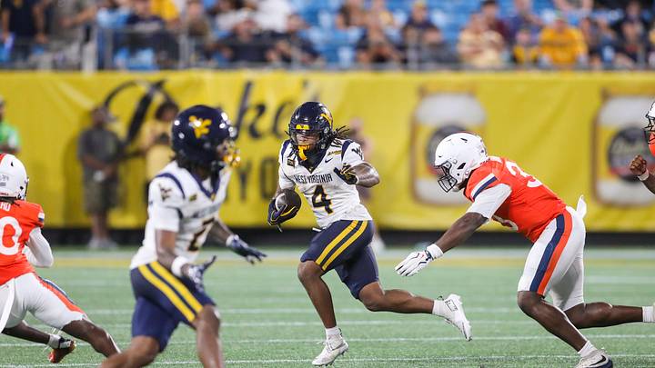 West Virginia carries the ball against Virginia in Charlotte. The Mountaineers’ ranked win helped reshape this week’s Big 12 power rankings. West Virginia carries the ball against Virginia in Charlotte. The Mountaineers’ ranked win helped reshape this week’s Big 12 power rankings.