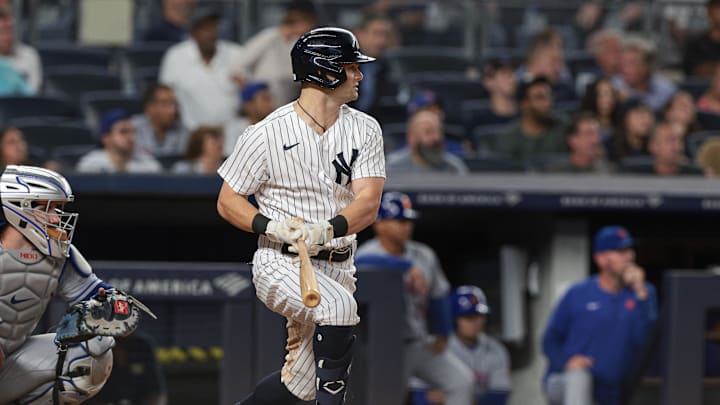 Aug 23, 2022; Bronx, New York, USA; New York Yankees left fielder Andrew Benintendi (18) hits one back up the middle