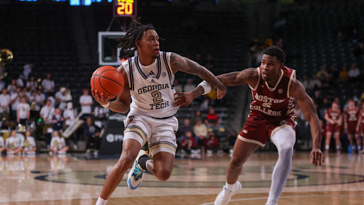 Jan 4, 2025; Atlanta, Georgia, USA; Georgia Tech Yellow Jackets guard Javian McCollum (2) drives past Boston College Eagles guard Fred Payne (5) in the second half at McCamish Pavilion. Mandatory Credit: Brett Davis-Imagn Images