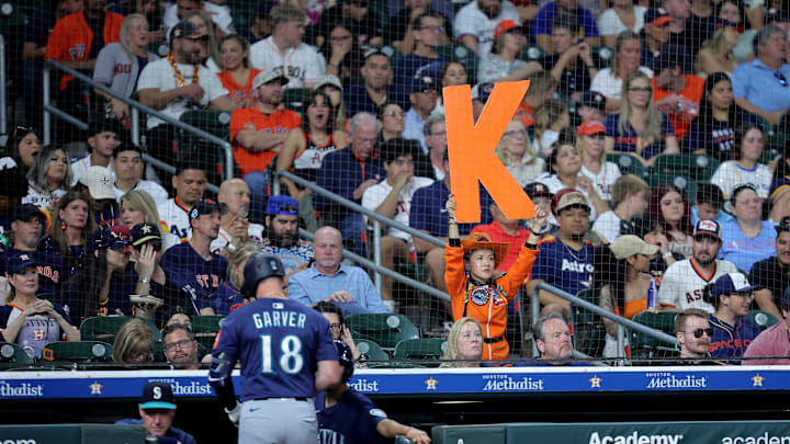 A Houston Astros fan holds up a K sign after Seattle Mariners pinch hitter Mitch Garver (18) strikes out during the seventh inning at Daikin Park. A Houston Astros fan holds up a K sign after Seattle Mariners pinch hitter Mitch Garver (18) strikes out during the seventh inning at Daikin Park.