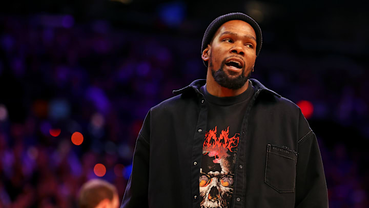 Nov 20, 2024; Phoenix, Arizona, USA; Phoenix Suns forward Kevin Durant looks on from the sidelines during the game between the Phoenix Suns and the New York Knicks at Footprint Center. Mandatory Credit: Mark J. Rebilas-Imagn Images