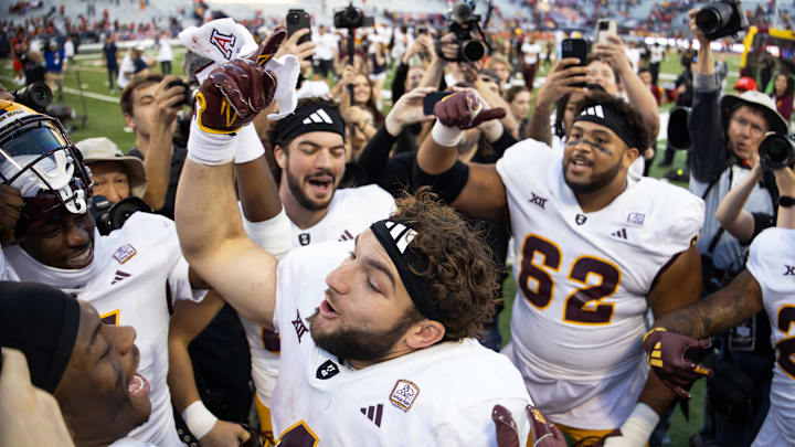Nov 30, 2024; Tucson, Arizona, USA; Arizona State Sun Devils running back Cam Skattebo (4) celebrates after defeating the Arizona Wildcats during the Territorial Cup at Arizona Stadium. Mandatory Credit: Mark J. Rebilas-Imagn Images
