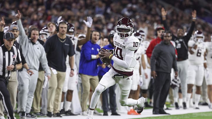 Dec 27, 2023; Houston, TX, USA; Texas A&M Aggies quarterback Marcel Reed (10) runs and scores a