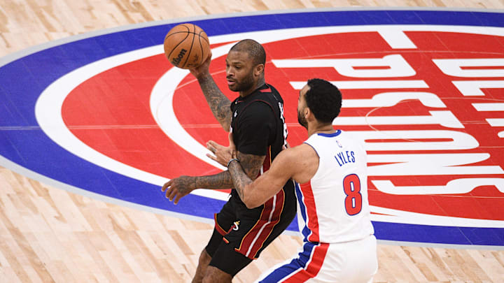 Dec 19, 2021; Detroit, Michigan, USA; Miami Heat forward P.J. Tucker (17) as Detroit Pistons forward Trey Lyles (8) defends during the second quarter at Little Caesars Arena. Mandatory Credit: Tim Fuller-Imagn Images