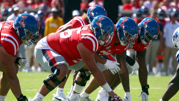 Sep 7, 2024; Oxford, Mississippi, USA; Mississippi Rebels offensive linemen Reece McIntyre (56) prepares to snap the ball during the first half against the Middle Tennessee Blue Raiders at Vaught-Hemingway Stadium. Mandatory Credit: Petre Thomas-Imagn Images
