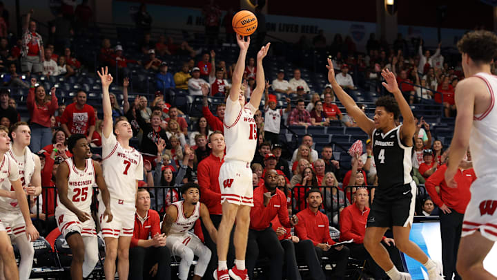 Nov 27, 2025; San Diego, CA, USA; Wisconsin Badgers guard Isaac Gard (15) shoots the ball against Providence Friars during the second half at Jenny Craig Pavilion. Nov 27, 2025; San Diego, CA, USA; Wisconsin Badgers guard Isaac Gard (15) shoots the ball against Providence Friars during the second half at Jenny Craig Pavilion.