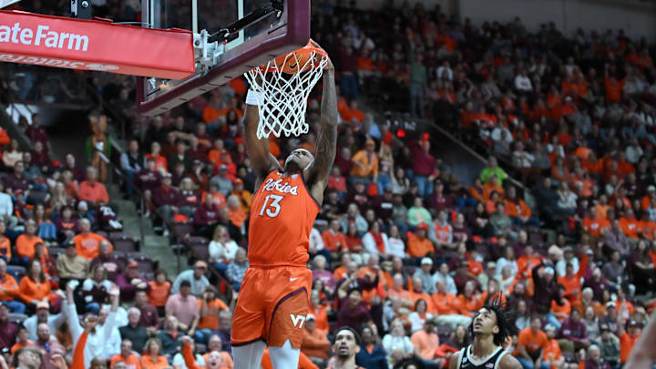 Feb 21, 2026; Blacksburg, Va.; Virginia Tech forward Amani Hansberry (13) dunks the ball against Wake Forest.
