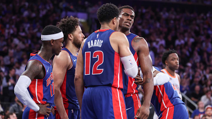 Apr 29, 2025; New York, New York, USA; Detroit Pistons center Jalen Duren (0) is helped up by forward Tobias Harris (12) in the fourth quarter against the New York Knicks during game five of first round for the 2025 NBA Playoffs at Madison Square Garden. Mandatory Credit: Wendell Cruz-Imagn Images