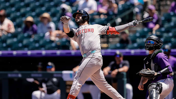 Jun 22, 2025; Denver, Colorado, USA; Arizona Diamondbacks third baseman Eugenio Suarez (28) watches his ball on a double in the second inning against the Colorado Rockies at Coors Field. Mandatory Credit: Isaiah J. Downing-Imagn Images