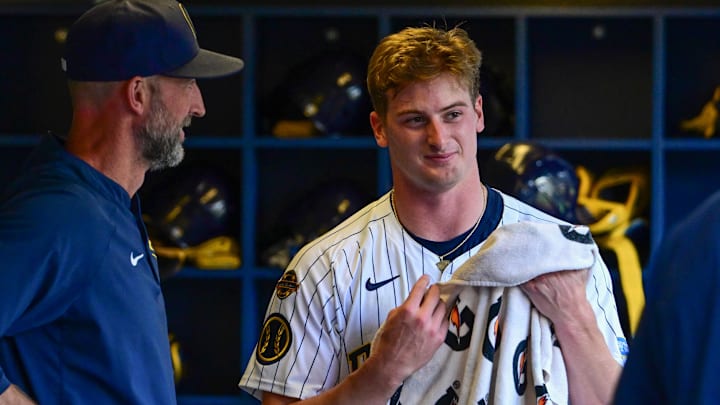 Jun 28, 2025; Milwaukee, Wisconsin, USA; Milwaukee Brewers starting pitcher Quinn Priester (46) relaxes in the dugout after pitching seven scoreless innings against the Colorado Rockies at American Family Field. Mandatory Credit: Benny Sieu-Imagn Images