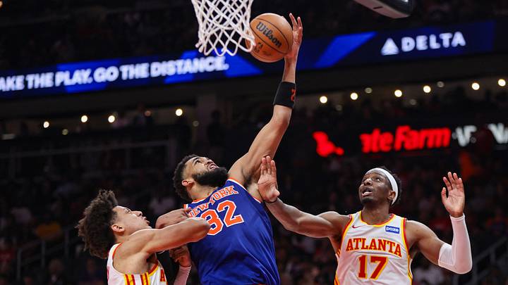 Apr 30, 2026; Atlanta, Georgia, USA; New York Knicks center Karl-Anthony Towns (32) grabs a rebound past Atlanta Hawks forward Jalen Johnson (1) and forward Onyeka Okongwu (17) in the second quarter during game six of the first round of the 2026 NBA Playoffs at State Farm Arena. Mandatory Credit: Brett Davis-Imagn Images Apr 30, 2026; Atlanta, Georgia, USA; New York Knicks center Karl-Anthony Towns (32) grabs a rebound past Atlanta Hawks forward Jalen Johnson (1) and forward Onyeka Okongwu (17) in the second quarter during game six of the first round of the 2026 NBA Playoffs at State Farm Arena. Mandatory Credit: Brett Davis-Imagn Images