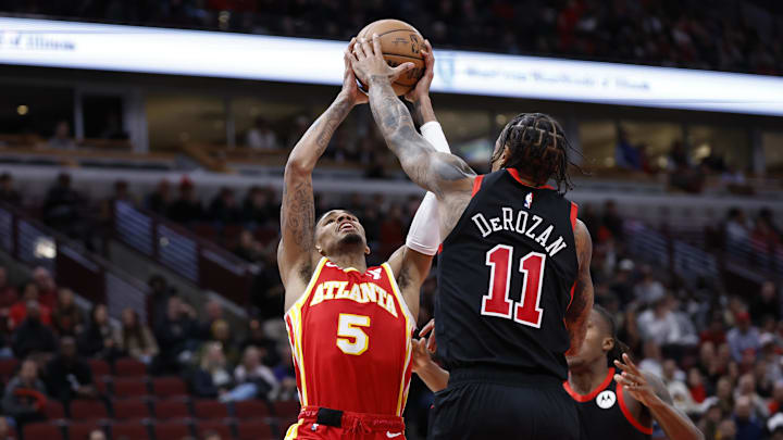 Apr 1, 2024; Chicago, Illinois, USA; Atlanta Hawks guard Dejounte Murray (5) shoots against the Chicago Bulls during the second half at United Center. Mandatory Credit: Kamil Krzaczynski-USA TODAY Sports