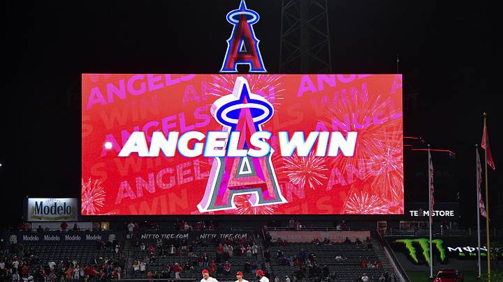May 5, 2026; Anaheim, California, USA; Los Angeles Angels center fielder Mike Trout (27) left fielder Bryce Teodosio (22) and right fielder Jo Adell (7) celebrate the victory against the Chicago White Sox at Angel Stadium. Mandatory Credit: Gary A. Vasquez-Imagn Images